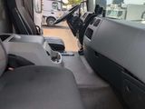 a view of the inside of a truck from the driver ' s seat