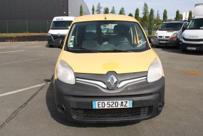 a yellow and black van parked in a parking lot