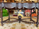 a table that has a picture on it in the middle of a room