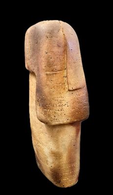 an image of a stone statue of a man ' s head on a black background