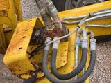 a close up of a fork with a bunch of hoses attached to it