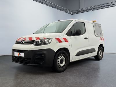 the white van is parked in the garage with a red stripe on the side