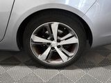 a close up of a car ' s wheel on the floor