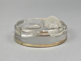 a silver and gold ring with a white bow on it