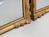 pair of antique gold framed mirrors with floral decoration