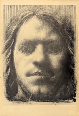 an old photo of a man with glasses and long hair