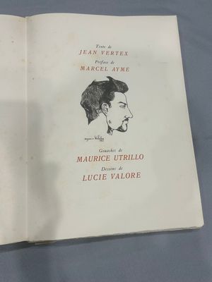 an open book with a drawing of a man ' s face on it