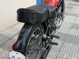 a motorcycle that is parked on the side of the street