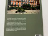 the back cover of a book with a picture of a building in the background