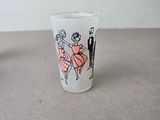 a shot glass with a picture of a couple on it