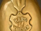 an antique brass fireman ' s helmet with a shield on top of it