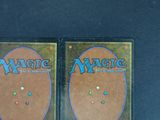 two decks of magic the gathering are shown on a table
