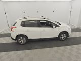 a picture of a white car parked in a garage
