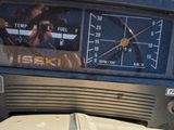 a close up of a car dashboard with a clock
