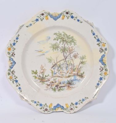 une assiette sur laquelle est représenté un bateau