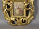a picture of a picture of a woman in a gold frame