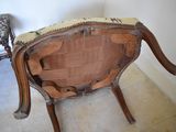 a wooden chair with a woven seat and back rest