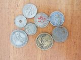 a lot of coins that are on the table