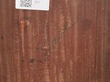 an image of a piece of wood with a sticker on it