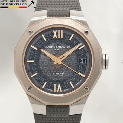an image of a close up of a wrist watch with roman numerals on it