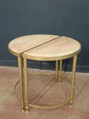 a small round table with a wooden top on a carpeted floor