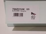 a white box with a pair of shoes on it