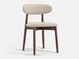 vue de profil d'une chaise dont l'assise est recouverte d'un tissu beige