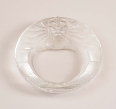 an image of a clear glass ring with a face on it