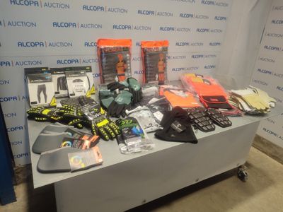 a table with a lot of items on it in front of a wall