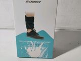 the box of the shoe is open on a white surface