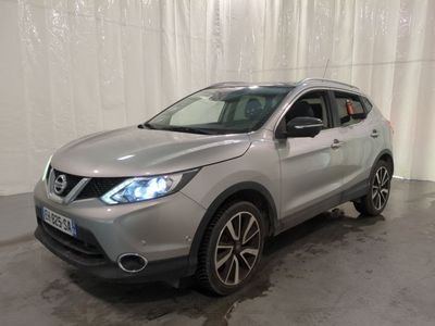 the silver nissan qx sport is parked in a garage