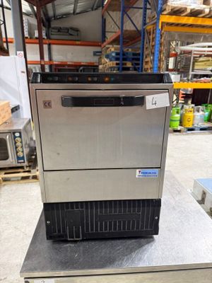 an image of a stainless steel ice machine in a warehouse