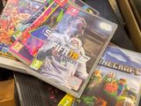 a lot of video games sitting on a table