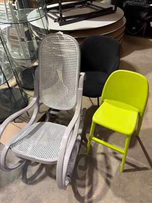two chairs sitting next to each other in a room