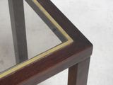 a close up of a glass table with a wooden frame