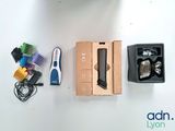a box of toothbrushes, a tooth brush, and other items laid out on a table