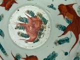 a bowl with a painting of two birds on it
