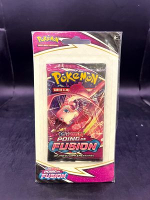 a close up of a box of pokemon trading cards on a table
