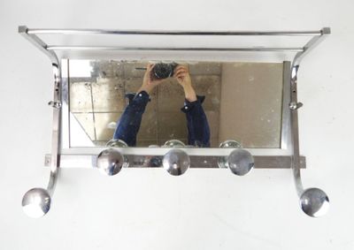 a man taking a picture of himself in the mirror