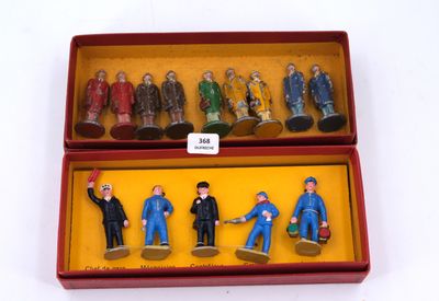 toy figurines in a red box on a white surface