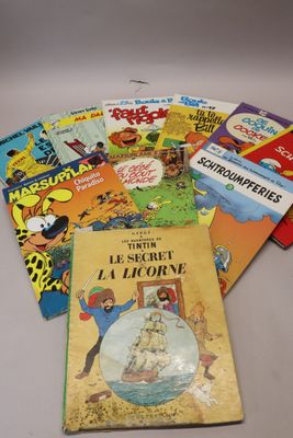a pile of children ' s books sitting on top of a table