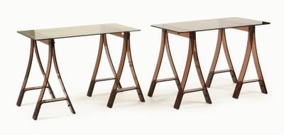 pair of mid - century style side tables with glass tops