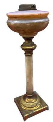 a small pedestal with a clock on top of it