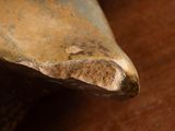 a close up of a piece of metal on a table