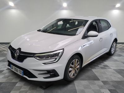 a white car is parked in a room with a checkered floor