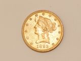 an image of a gold coin with a woman ' s head on it