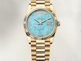 rolex day - date watch in yellow gold with a blue dial