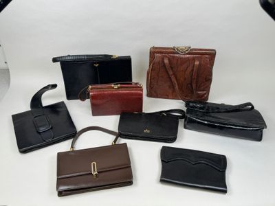 a lot of purses that are sitting on a table