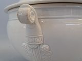 a white bowl with a lid that has a dog on it