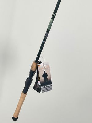 a close up of a fishing rod with a tag attached to it